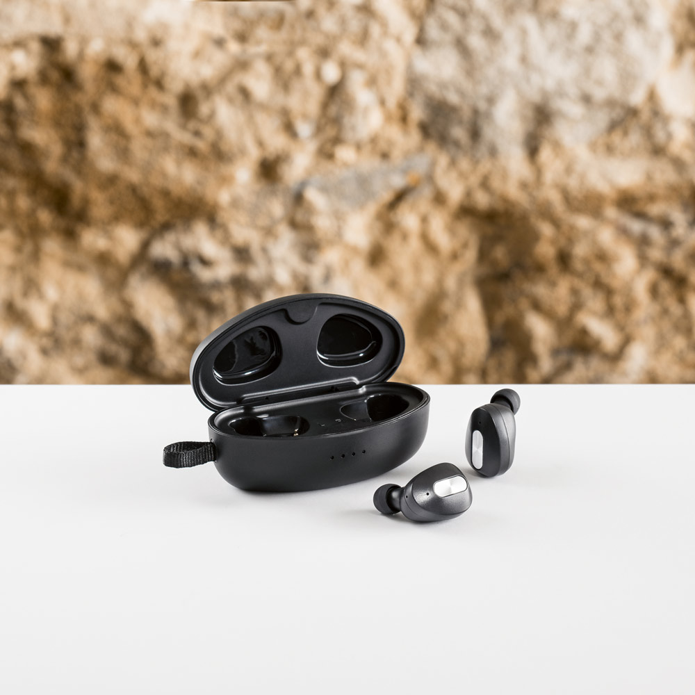DESCRY. Wireless charger in zinc and Wireless earphones in metal and ABS acrylic