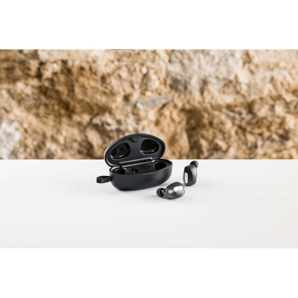 DESCRY. Wireless charger in zinc and Wireless earphones in metal and ABS acrylic